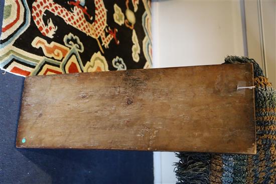 A Tibetan carved panel, 18th/19th century, 72.5cm x 24cm
